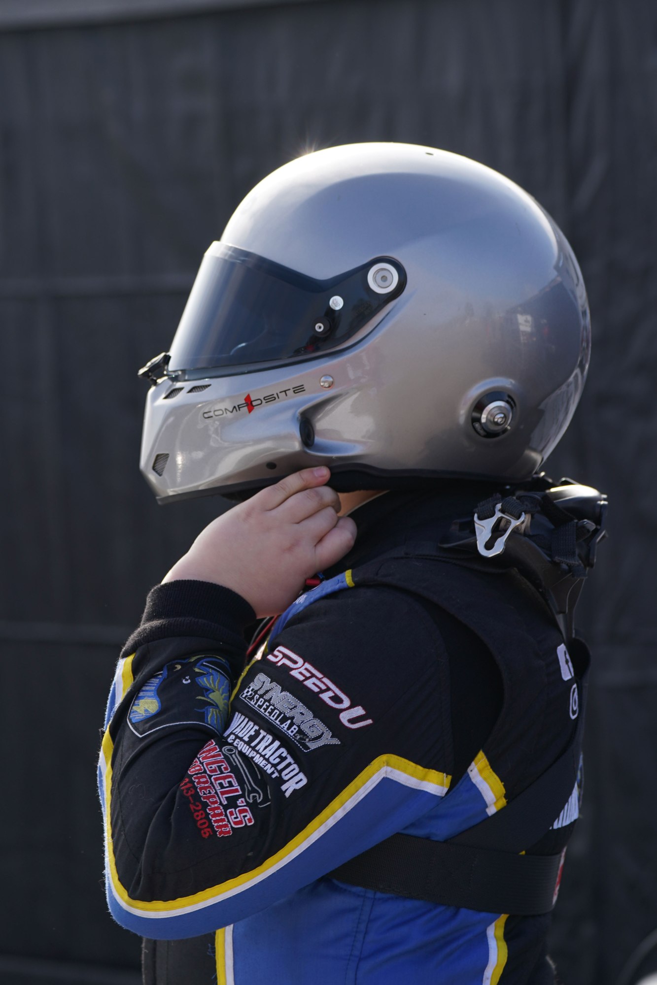 Jaxon Burnett wearing his helmet and racing suit