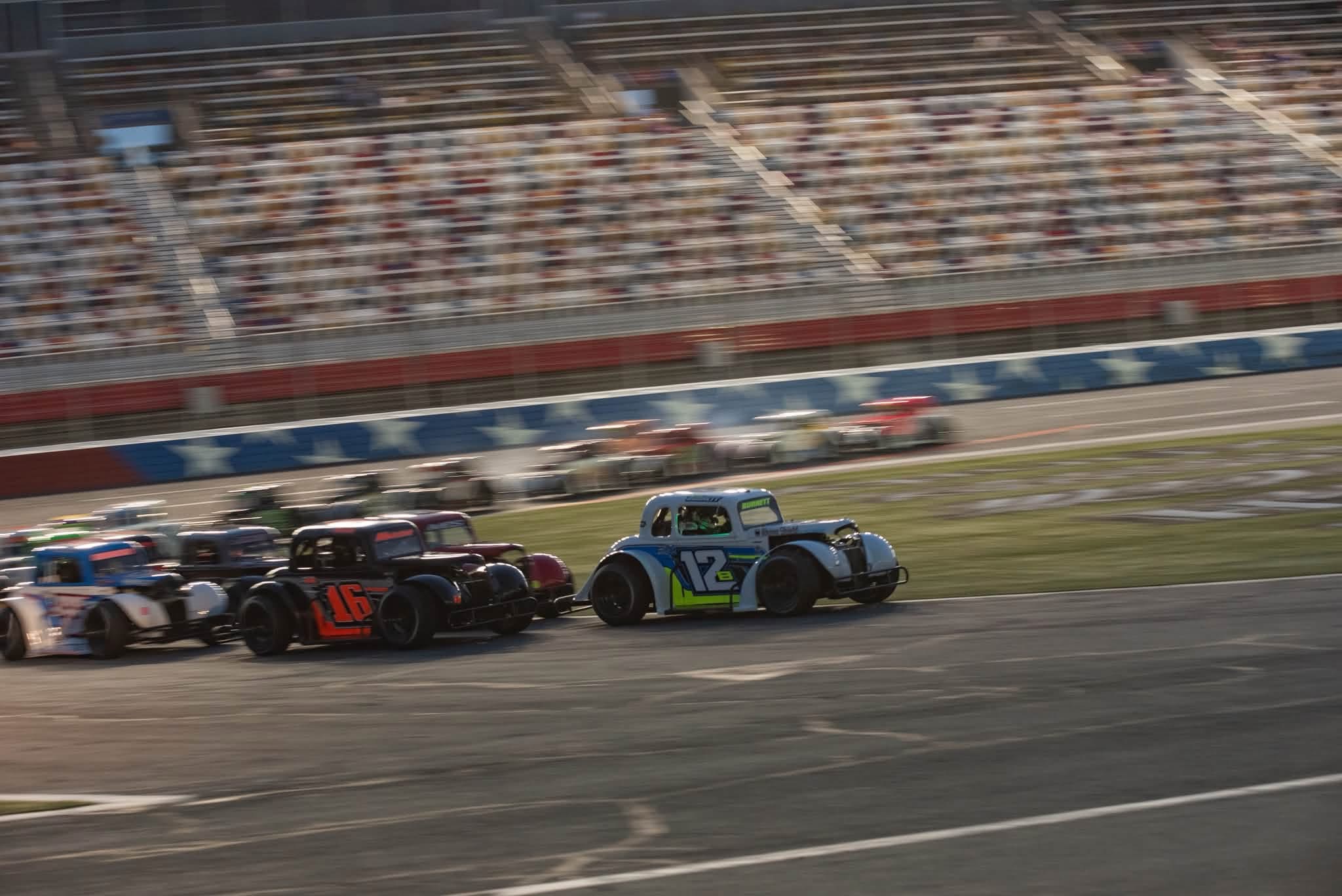 Jaxon Burnett’s number 12B Legend car racing alongside the field