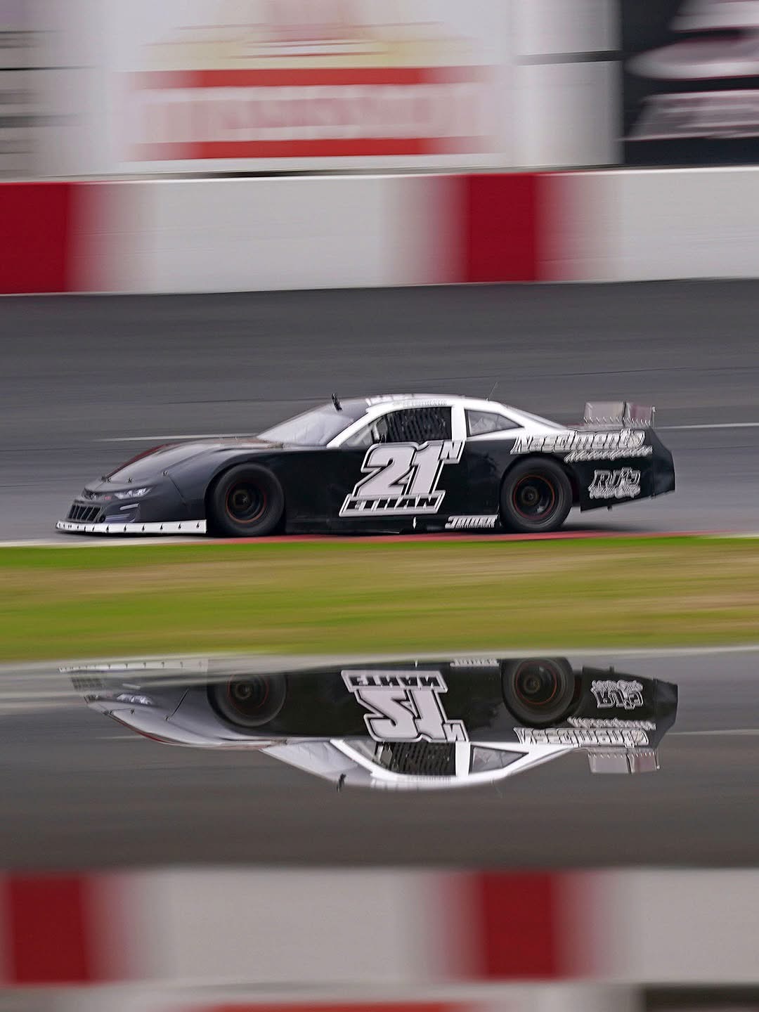 Jaxon’s number 21 Junior Late Model on track with its reflection below